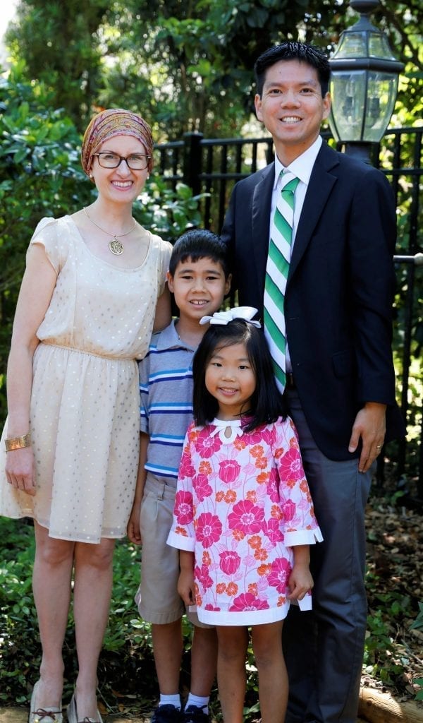 Childhood cancer survivor Margaret and her husband and two kids. 