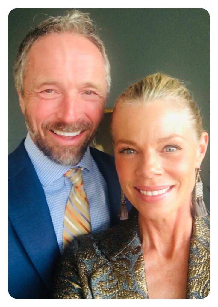 Dr. Jeff Myers and his wife smile in formal attire